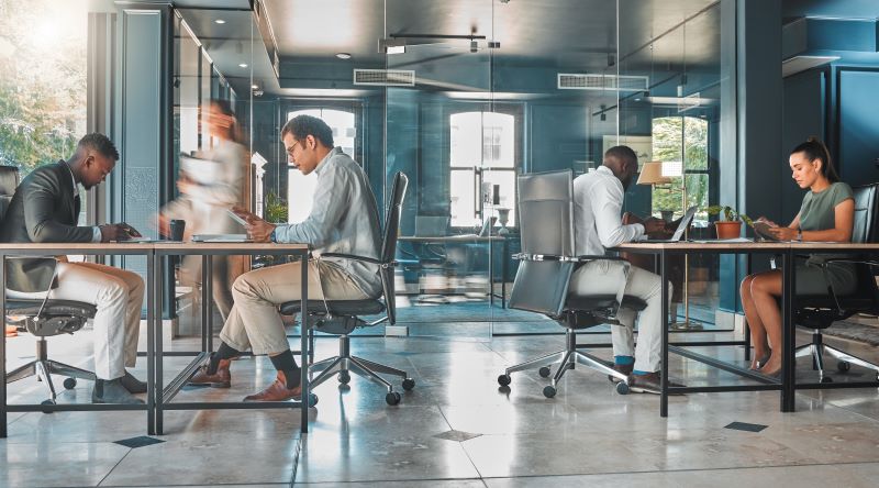 Professionals working in a modern, efficient office environment, showcasing the balance of aesthetics and functionality in business spaces.