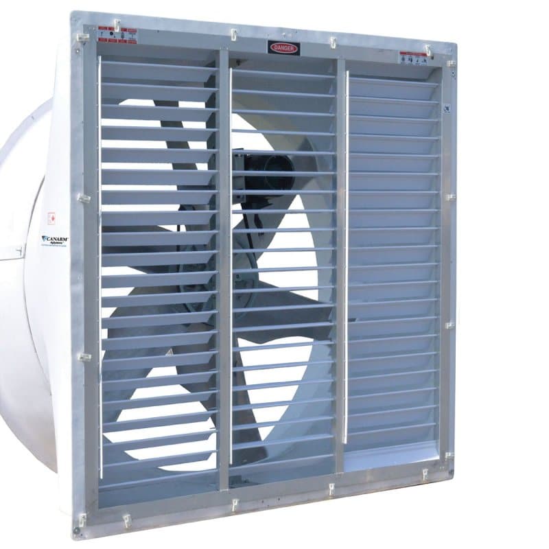 Large industrial barn fan with protective shutters, designed to improve airflow and support animal health by reducing heat and odors in livestock areas.