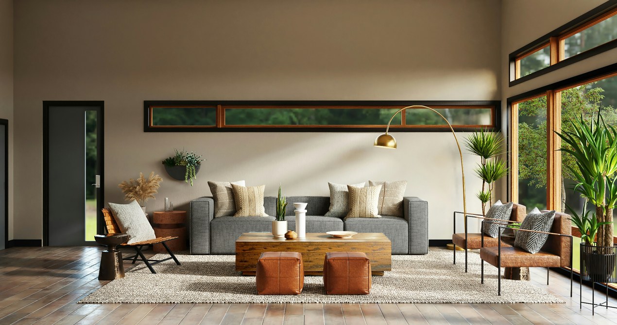 Modern living room with neutral color palette, gray sofa, wood coffee table, leather chairs, indoor plants, and large windows creating a seamless indoor-outdoor home design connection.