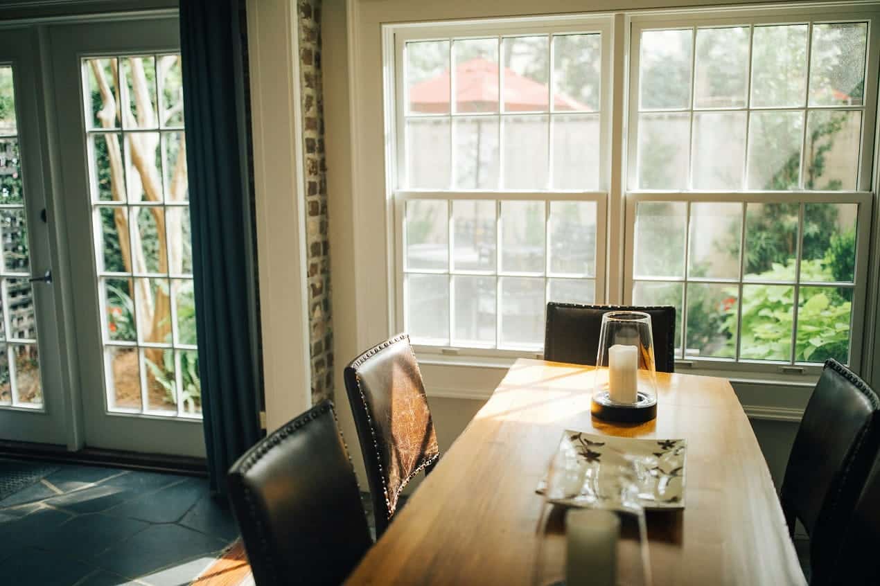 Dining room with large multi-pane windows, ideal candidates for custom window treatments
